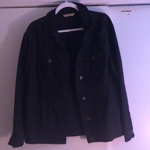 Oversized stressed black jean trucker jacket